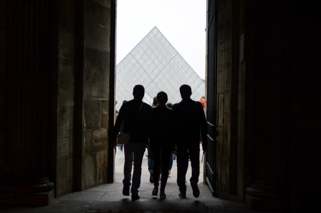 Three students walking to the Louvre